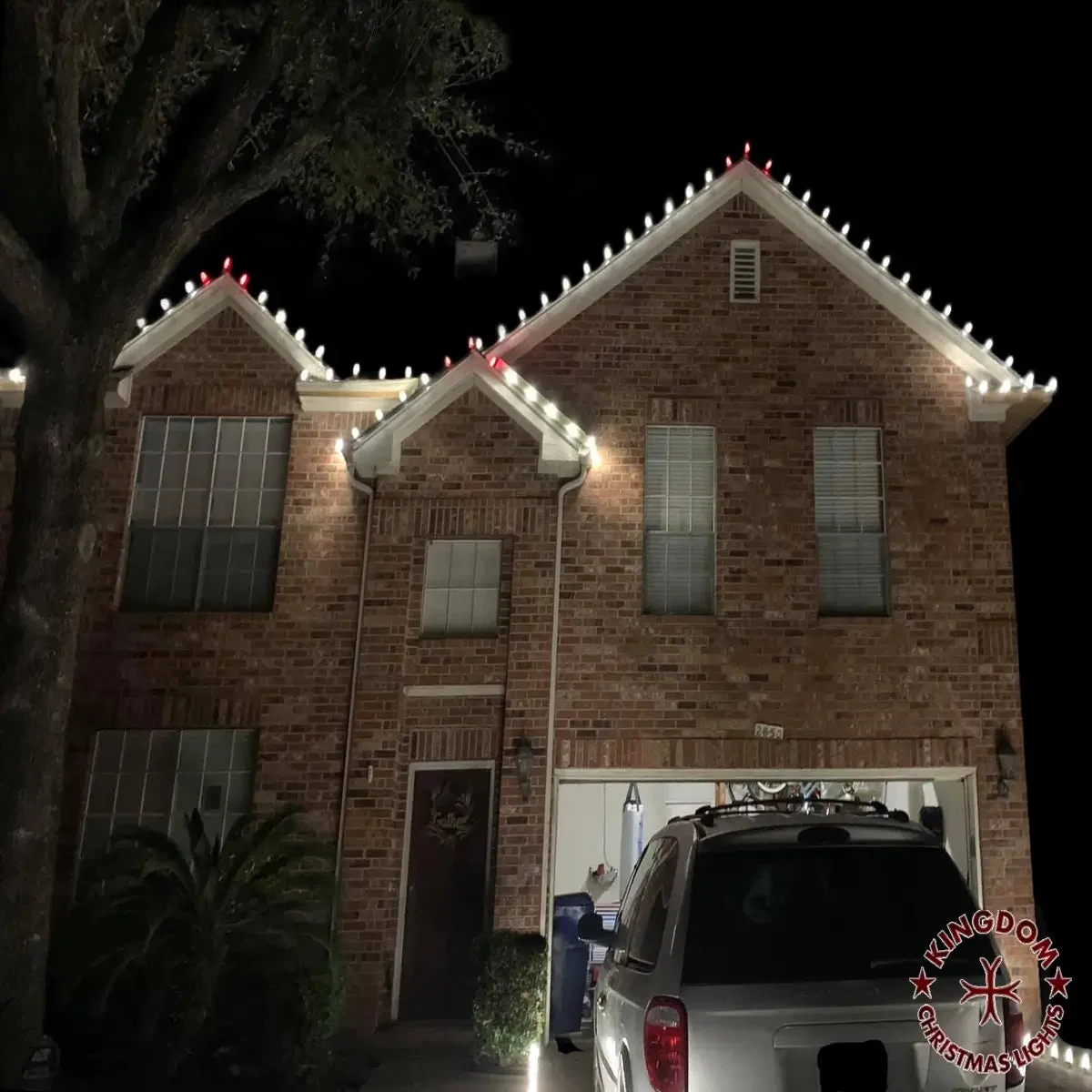 Completed warm white and red-tip Christmas light display at night