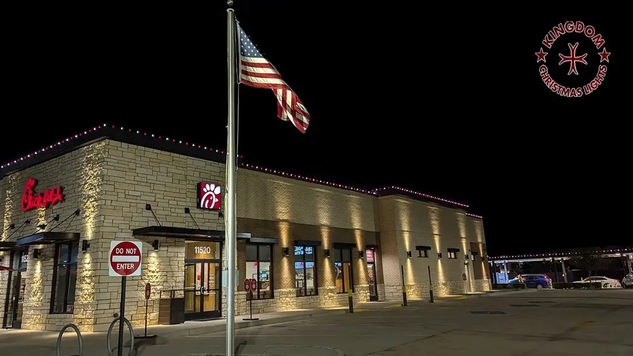 Commercial Christmas light installation on a Chick-fil-A building